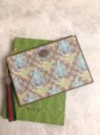 Gucci-Tiger-Print-GG-Pouch.png